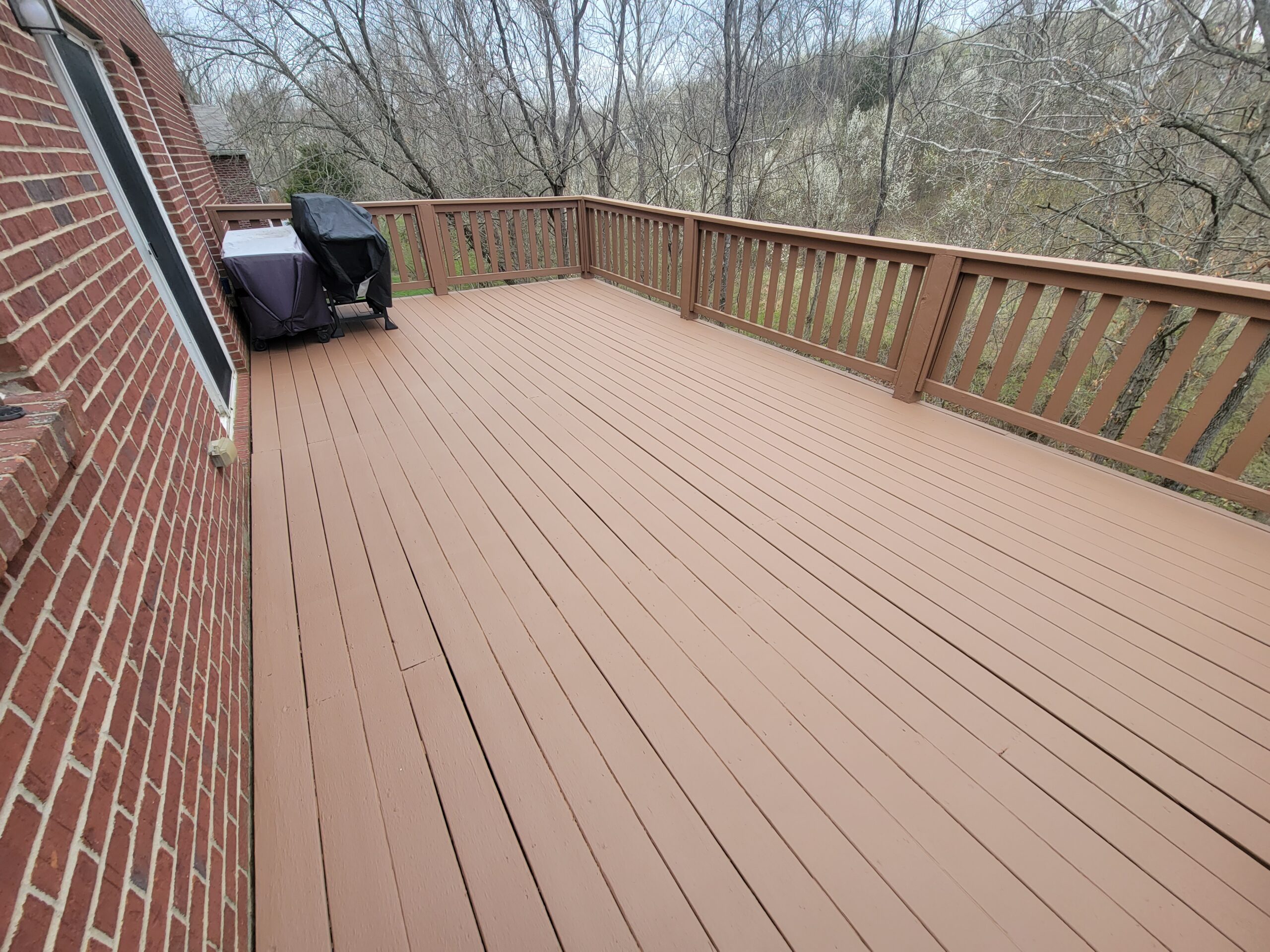 image of deck that has been resurfaced from peeling deck paint with a deck coating designed to encapsulate and lockdown peeling deck paints